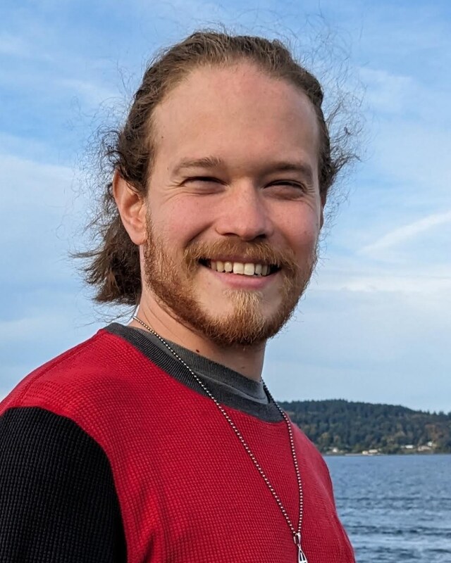 Shea Engle standing by the water